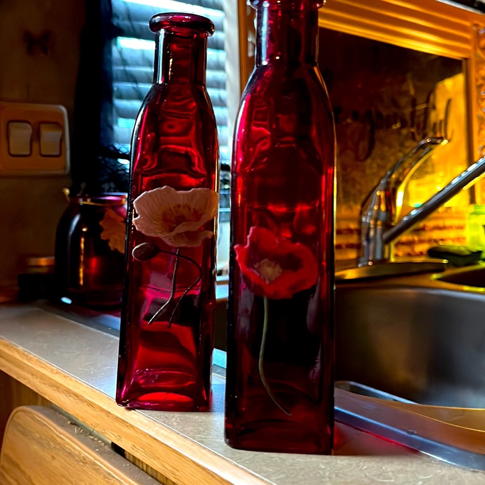 4 red glass vases